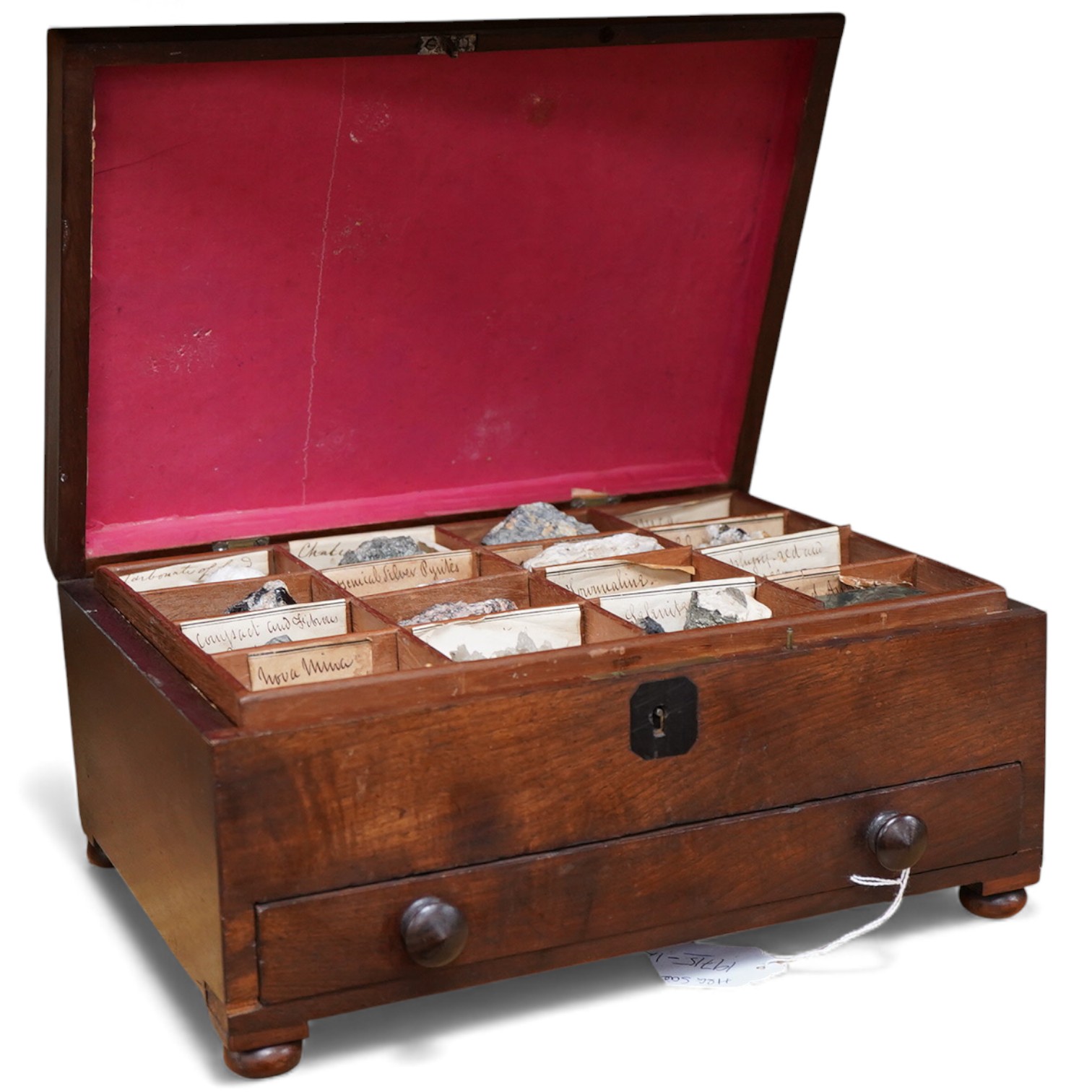 An early 19th century mahogany cased collection of mineral samples with old labels, comprising two removable trays and a drawer beneath, the case raised on bun feet, 30cm wide, 22cm deep, 14cm high